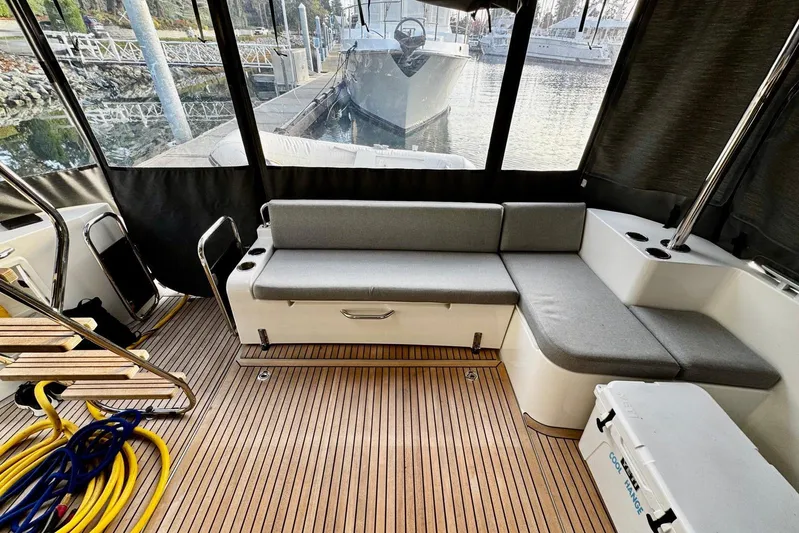 Changes In Latitude Yacht Photos Pics Interior of 2022 Beneteau Swift Trawler 41 Fly with seating and wooden flooring.