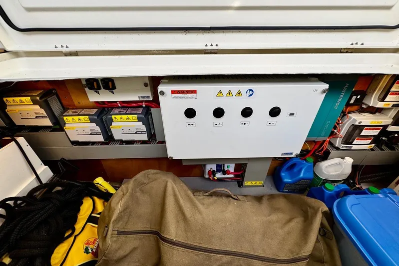 Changes In Latitude Yacht Photos Pics Electrical system of 2022 Beneteau Swift Trawler 41 Fly with control panel and storage items.