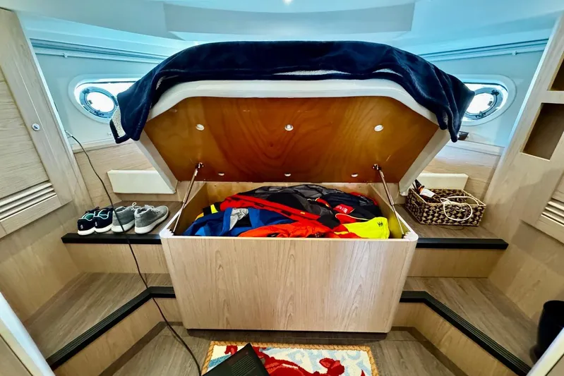 Changes In Latitude Yacht Photos Pics 2022 Beneteau Swift Trawler 41 Fly cabin with under-bed storage and nautical gear.
