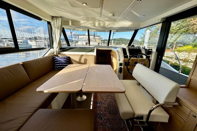 Changes In Latitude Yacht Photos Pics Interior of 2022 Beneteau Swift Trawler 41 Fly with elegant seating and helm.