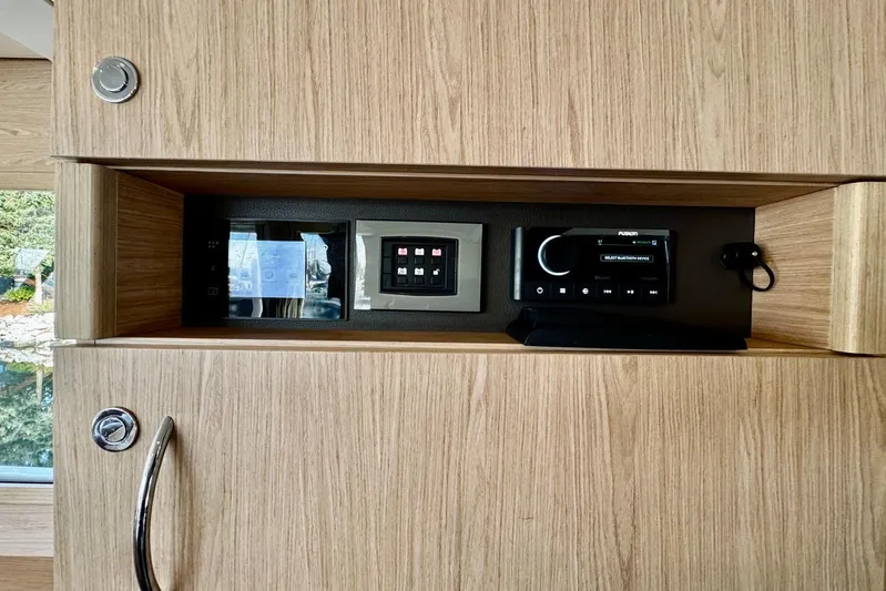 Changes In Latitude Yacht Photos Pics Control panel and audio system in 2022 Beneteau Swift Trawler 41 Fly interior.