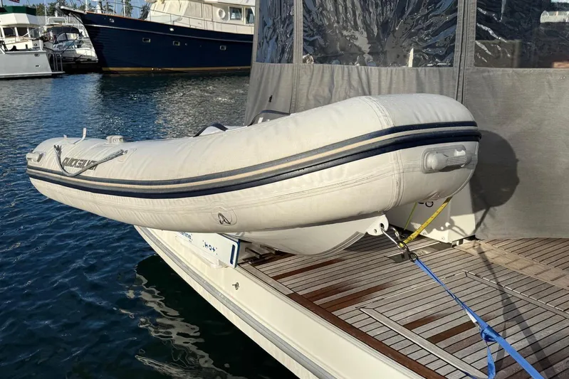 Changes In Latitude Yacht Photos Pics Inflatable dinghy secured on 2022 Beneteau Swift Trawler 41 Fly, docked at marina.