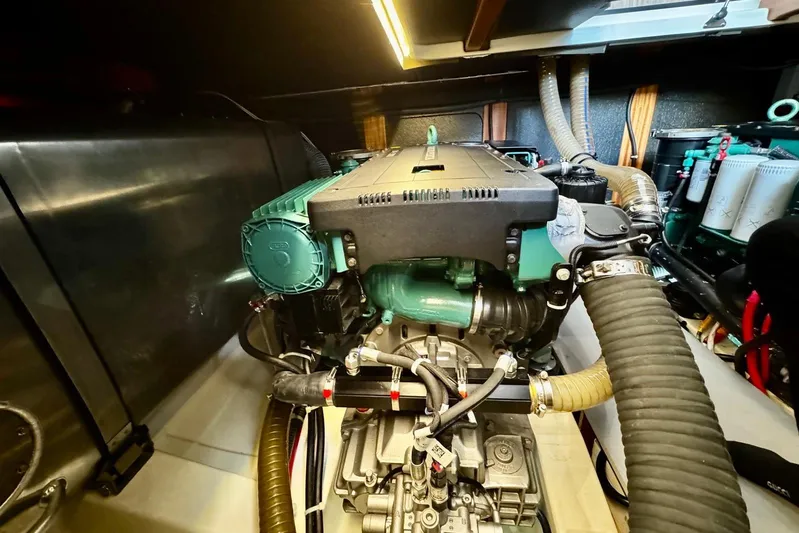 Changes In Latitude Yacht Photos Pics Engine room of 2022 Beneteau Swift Trawler 41 Fly, showcasing detailed machinery.