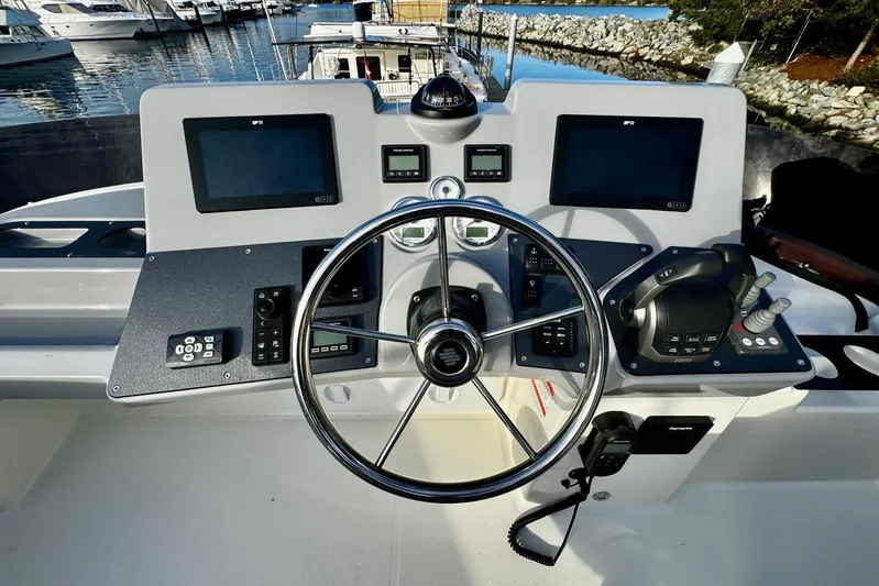 Changes In Latitude Yacht Photos Pics Cockpit of 2022 Beneteau Swift Trawler 41 Fly with modern navigation equipment.