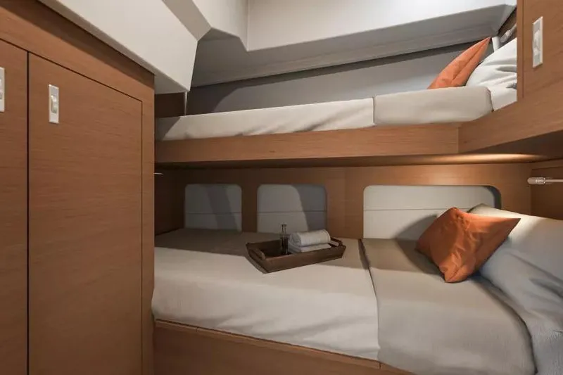  Yacht Photos Pics 2026 Beneteau Swift Trawler 37 cabin with cozy bunk beds and wooden interior.