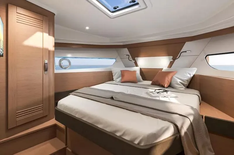  Yacht Photos Pics Luxurious cabin interior of 2026 Beneteau Swift Trawler 37 with modern design and cozy bedding.