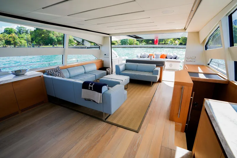 My Veloce Yacht Photos Pics Luxurious interior of 2013 Pershing 82 yacht with modern seating and scenic water views.
