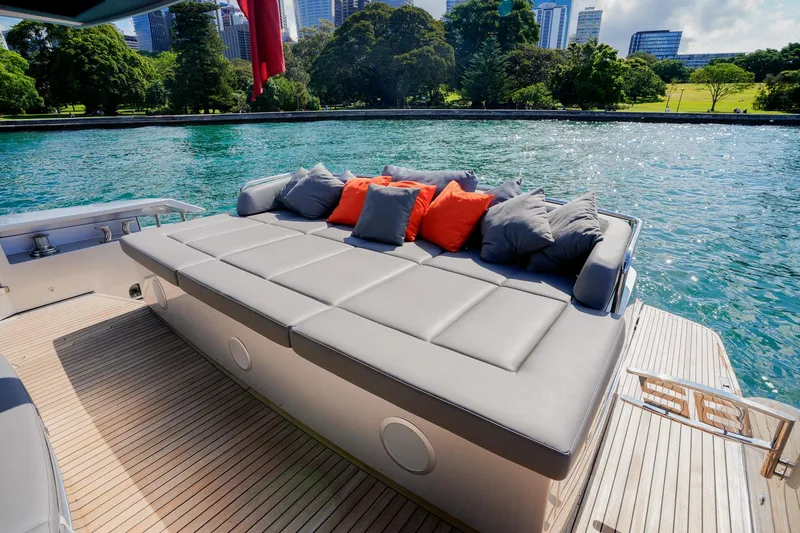 My Veloce Yacht Photos Pics Luxurious 2013 Pershing 82 yacht deck with plush seating and scenic waterfront view.