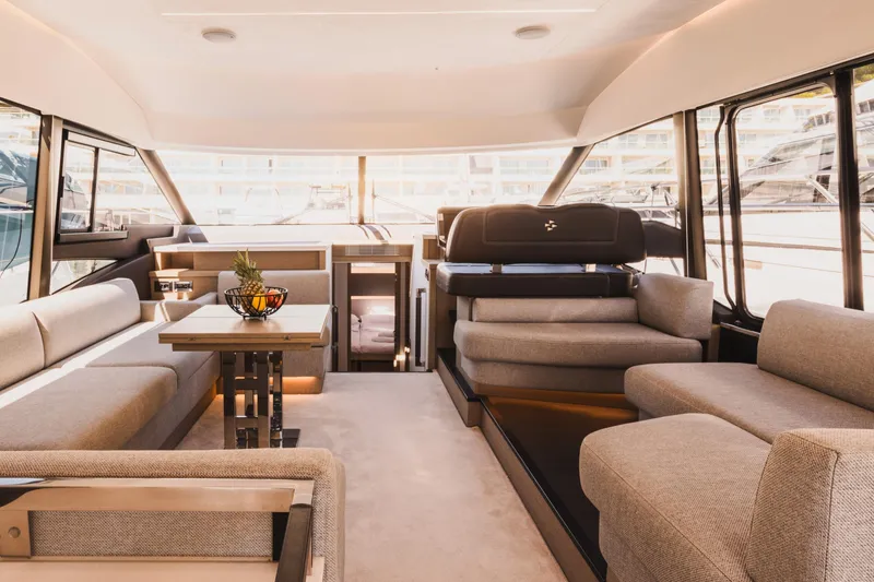  Yacht Photos Pics Luxurious interior of 2022 Prestige 590 yacht with elegant seating and modern decor.
