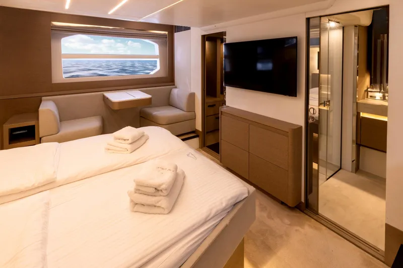  Yacht Photos Pics Luxurious interior of 2022 Prestige 590 yacht with ocean view, modern furnishings, and elegant decor.