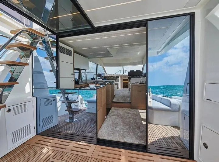  Yacht Photos Pics Luxurious 2022 Prestige 590 yacht interior with ocean view, featuring modern design and spacious layout.
