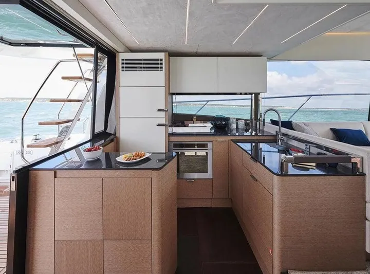  Yacht Photos Pics Luxurious kitchen interior on 2022 Prestige 590 yacht with ocean view.