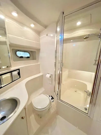 Casting Shadows Yacht Photos Pics Luxurious bathroom in 1998 Bayliner 3988 Command Bridge Motoryacht with shower and modern fixtures.