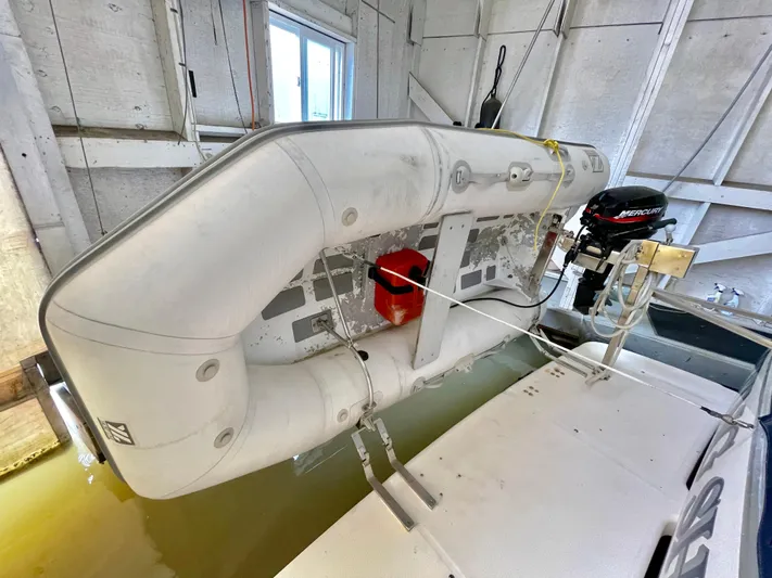 Casting Shadows Yacht Photos Pics Inflatable boat on Bayliner 3988 Command Bridge Motoryacht, 1998 model, docked indoors.