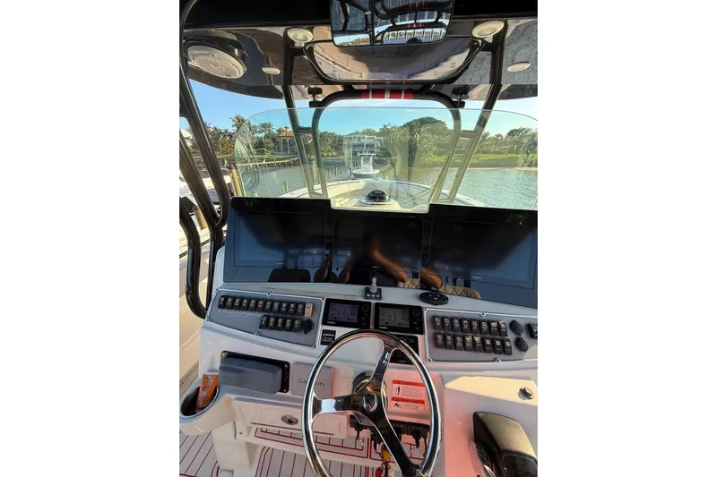 42 - Brokerage Higgins Yacht Photos Pics 2013 Hydra-Sports 42 boat cockpit with advanced navigation controls and steering wheel.