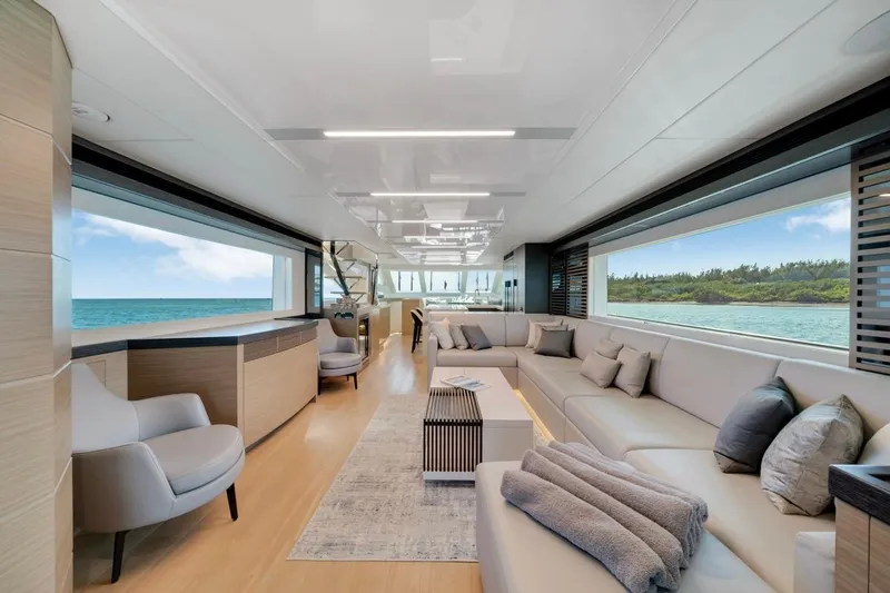 Valiant Yacht Photos Pics Luxurious interior of 2022 Horizon E81 yacht with ocean view and modern furnishings.
