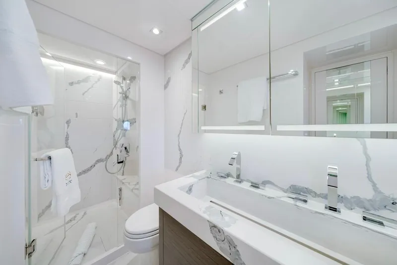 Valiant Yacht Photos Pics Modern bathroom with marble accents, featuring a glass shower and sleek fixtures, Horizon E81 2022.