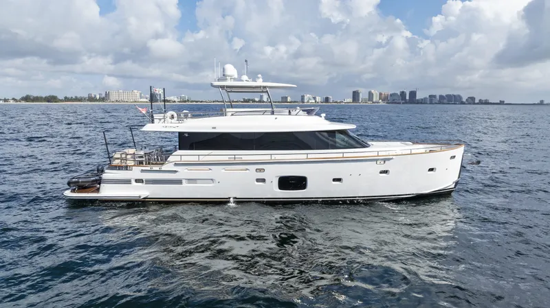  Yacht Photos Pics 2016 Azimut Magellano 76 yacht cruising on open water under a cloudy sky.