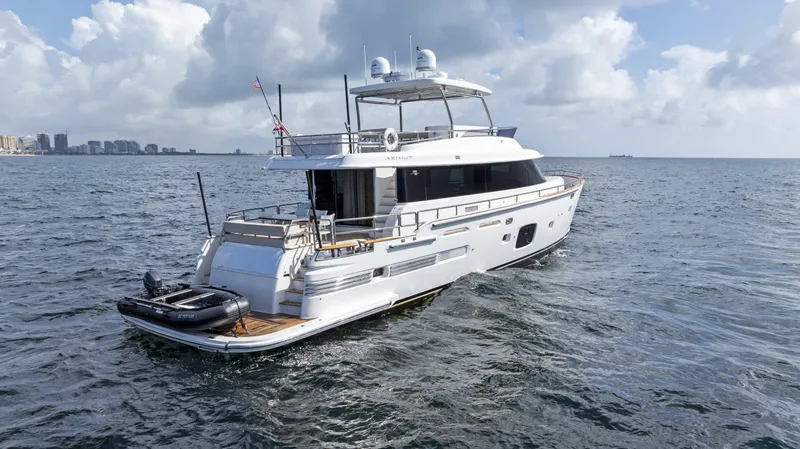  Yacht Photos Pics Azimut Magellano 76 yacht, 2016 model, cruising on open sea under cloudy sky.