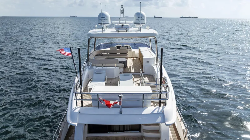  Yacht Photos Pics Azimut Magellano 76 yacht cruising on open sea, 2016 model, rear view.