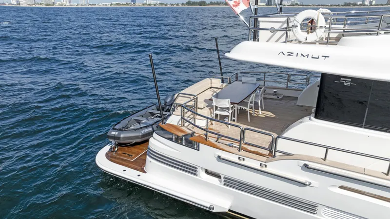  Yacht Photos Pics Luxury Azimut Magellano 76 yacht, 2016 model, docked on serene blue waters.