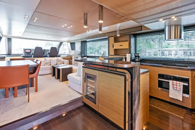  Yacht Photos Pics Luxurious interior of 2016 Azimut Magellano 76 yacht with modern kitchen and seating area.