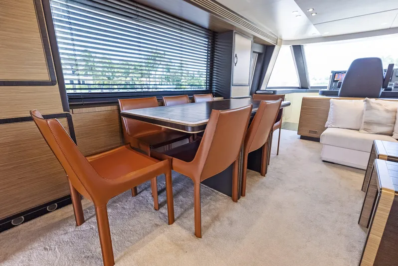 Yacht Photos Pics Luxurious interior of 2016 Azimut Magellano 76 yacht with elegant dining area.