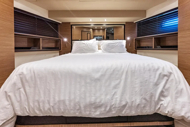 Yacht Photos Pics Luxurious bedroom interior of 2016 Azimut Magellano 76 yacht with elegant bedding.