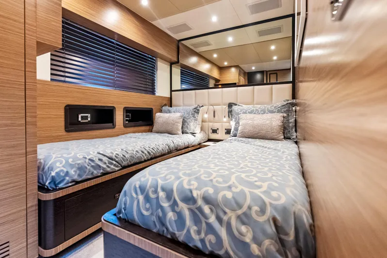  Yacht Photos Pics Luxurious twin bedroom in 2016 Azimut Magellano 76 yacht with elegant bedding and modern design.