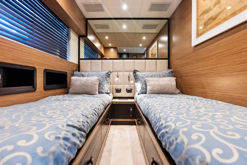  Yacht Photos Pics Luxurious twin cabin interior of 2016 Azimut Magellano 76 yacht with elegant bedding.