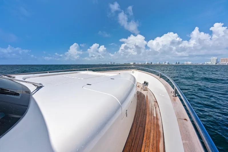  Yacht Photos Pics Azimut Magellano 76 yacht cruising on open sea under clear blue sky.