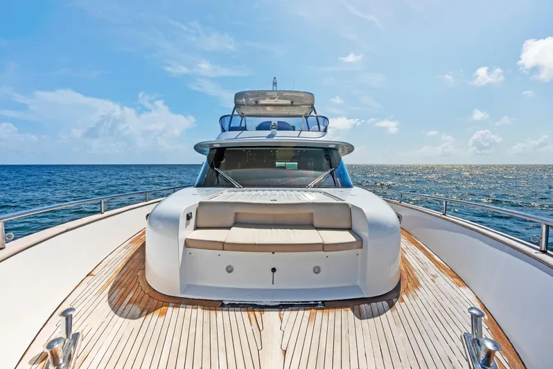  Yacht Photos Pics Azimut Magellano 76 yacht, 2016 model, cruising on open sea under clear blue sky.