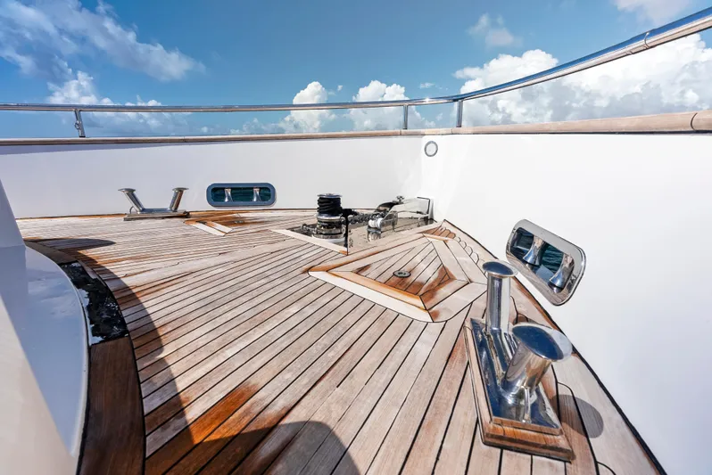  Yacht Photos Pics Azimut Magellano 76 yacht deck, 2016 model, featuring sleek wooden design and ocean view.