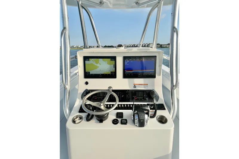  Yacht Photos Pics 2022 Contender 35 ST boat console with dual navigation screens and steering wheel.
