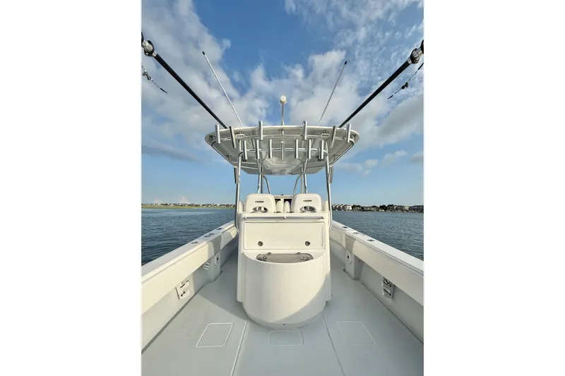  Yacht Photos Pics 2022 Contender 35 ST boat on water, clear sky, fishing rods visible.