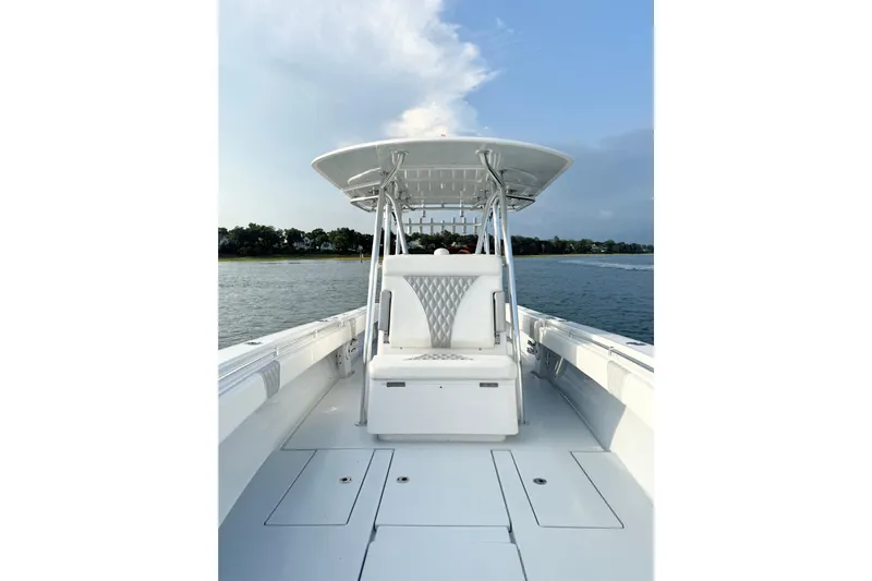  Yacht Photos Pics 2022 Contender 35 ST boat on water, featuring sleek white design and spacious deck.
