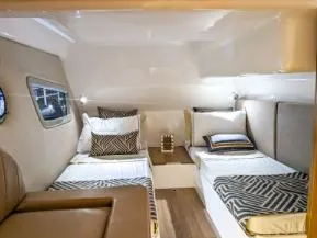 Custom Order Your 375 Today! Yacht Photos Pics 2025 Hanover 375 Outboard cabin interior with twin beds and modern decor.