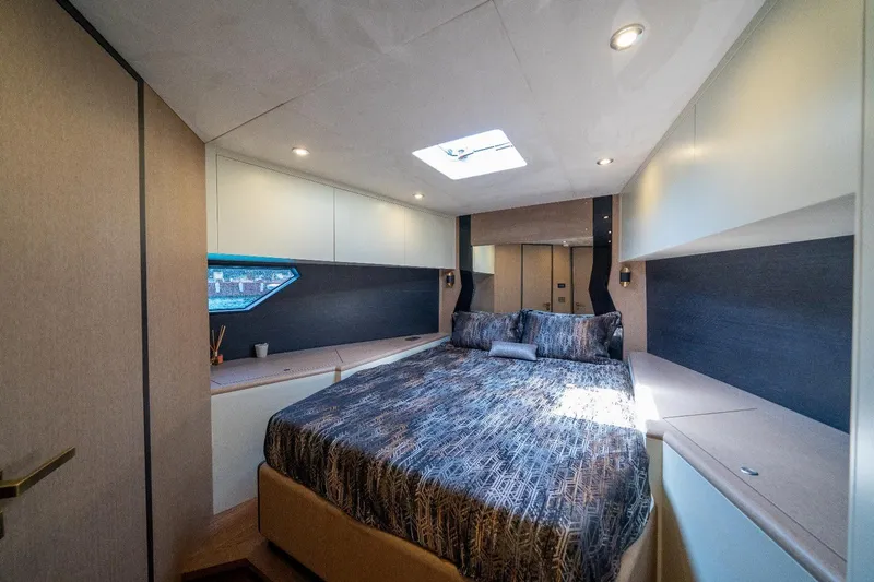  Yacht Photos Pics Luxurious bedroom interior of 2025 Phantom Spook 62 yacht with modern design and skylight.