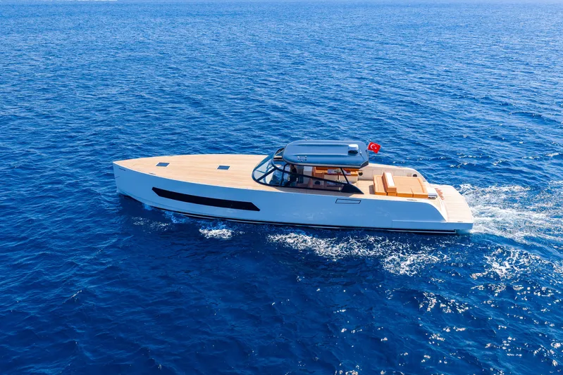  Yacht Photos Pics 2025 Phantom Spook 62 yacht cruising on open blue sea.