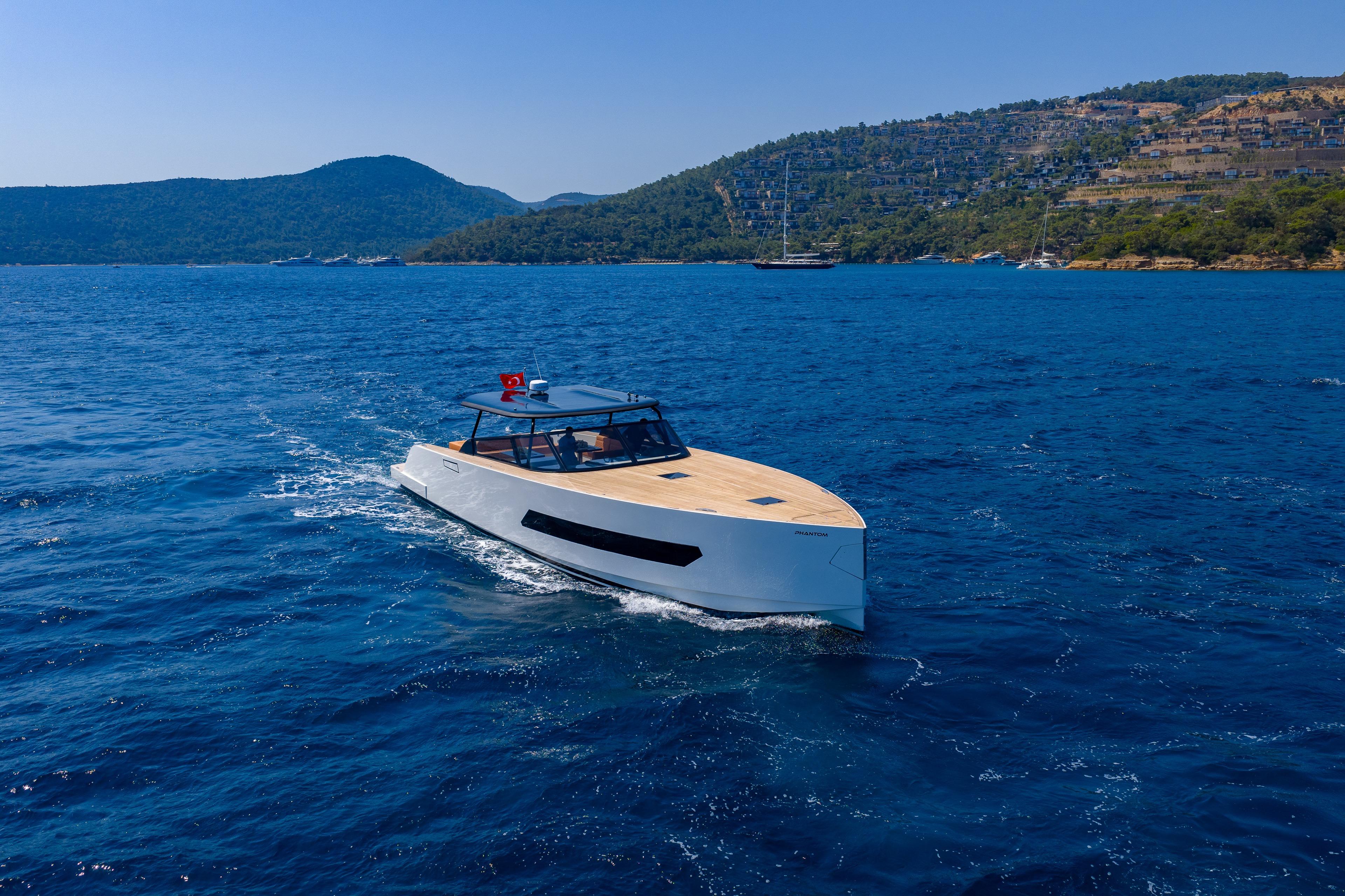 Luxury Phantom Spook 62 yacht cruising on blue waters, 2025 model.