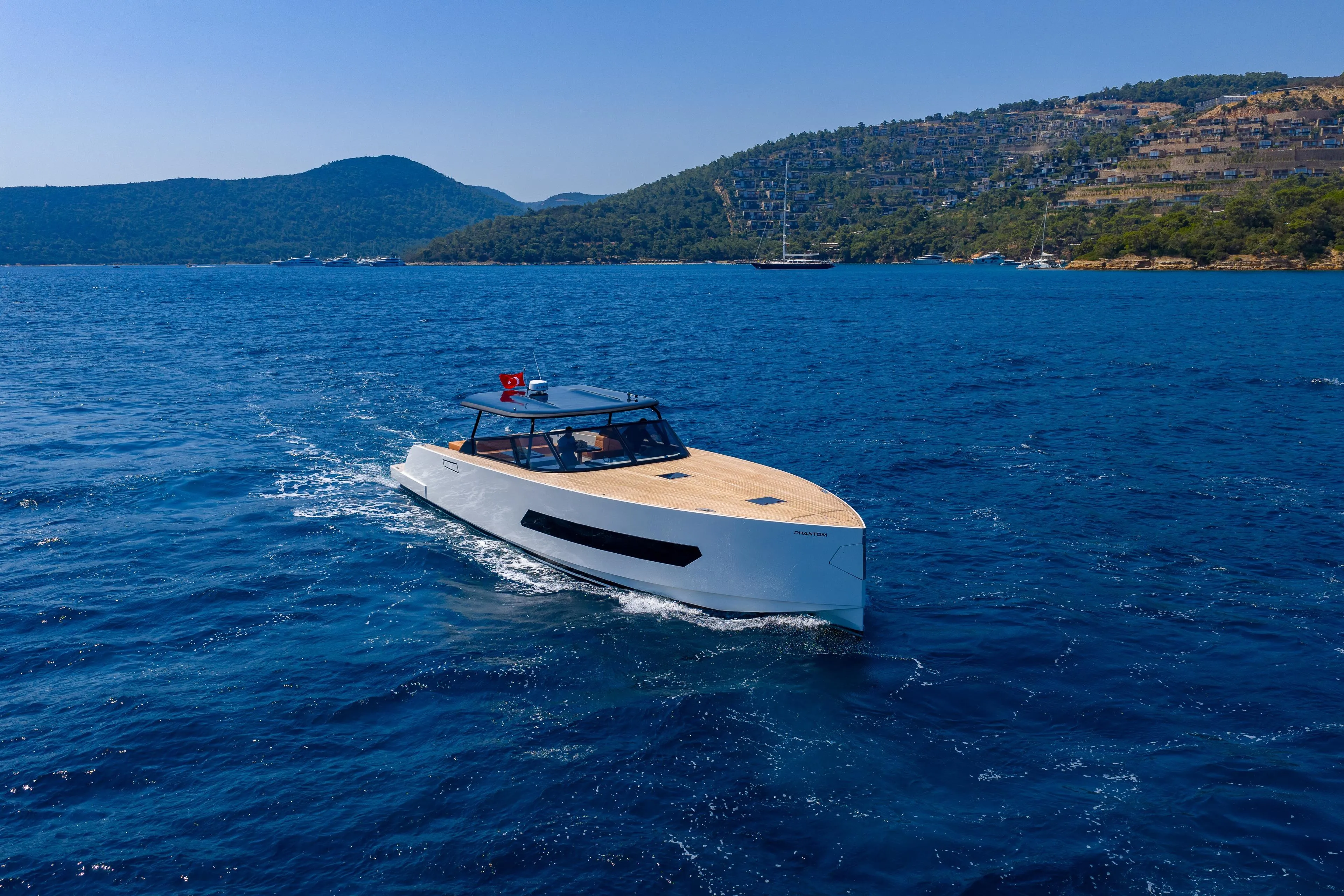 Luxury Phantom Spook 62 yacht cruising on blue waters, 2025 model.