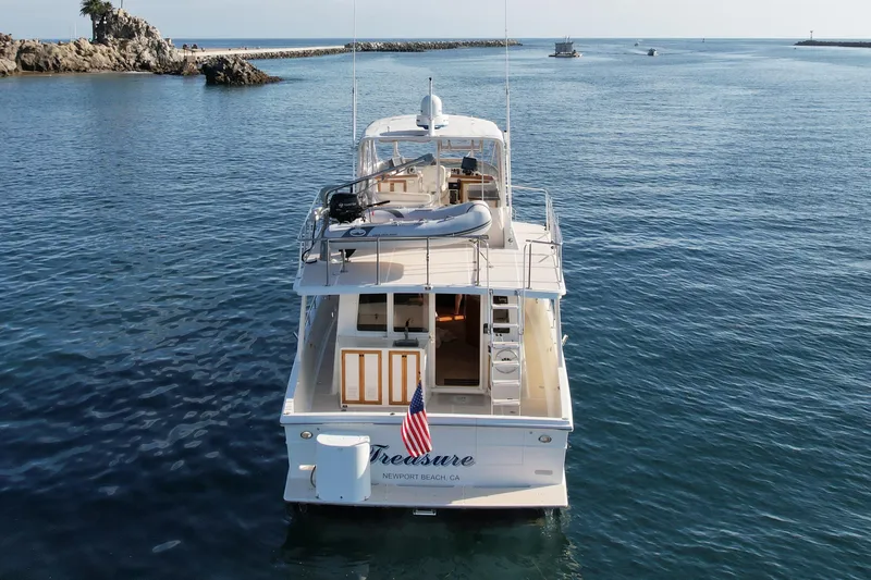 Treasure Yacht Photos Pics Offshore Yachts 1997 48 Sedan cruising in calm waters near Newport Beach.