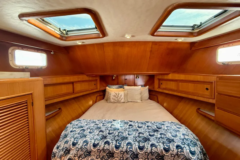 Treasure Yacht Photos Pics Luxurious 1997 Offshore Yachts 48 Sedan cabin with skylights and elegant wood finish.