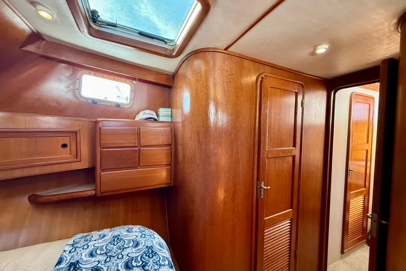 Treasure Yacht Photos Pics Interior of 1997 Offshore Yachts 48 Sedan with wooden cabinetry and skylight.