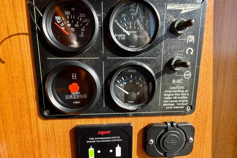 Treasure Yacht Photos Pics Control panel of a 1997 Offshore Yachts 48 Sedan with gauges and switches.
