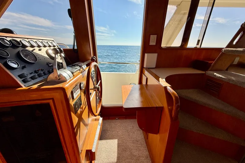 Treasure Yacht Photos Pics Interior helm of 1997 Offshore Yachts 48 Sedan with ocean view.