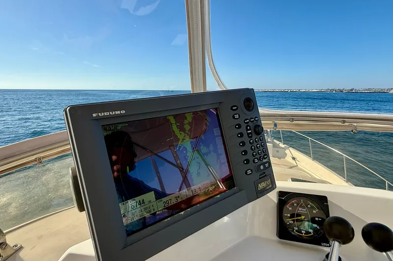 Treasure Yacht Photos Pics Navigation equipment on 1997 Offshore Yachts 48 Sedan, overlooking the ocean.