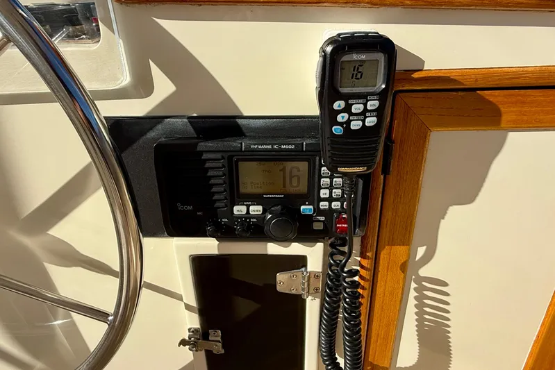 Treasure Yacht Photos Pics VHF marine radio on 1997 Offshore Yachts 48 Sedan, featuring Icom IC-M602 model.