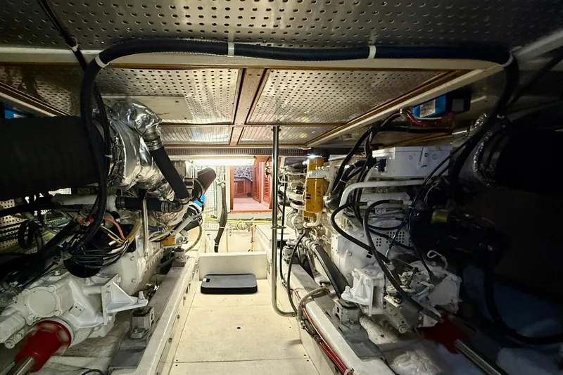 Treasure Yacht Photos Pics Engine room of a 1997 Offshore Yachts 48 Sedan, showcasing mechanical components and wiring.