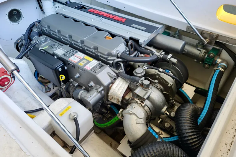  Yacht Photos Pics Engine compartment of a 2005 Thriller Powerboats Super Cat 55, showcasing detailed mechanical components.